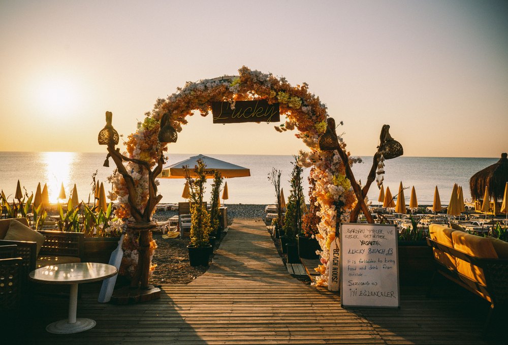Beach elopement wedding arch at sunset